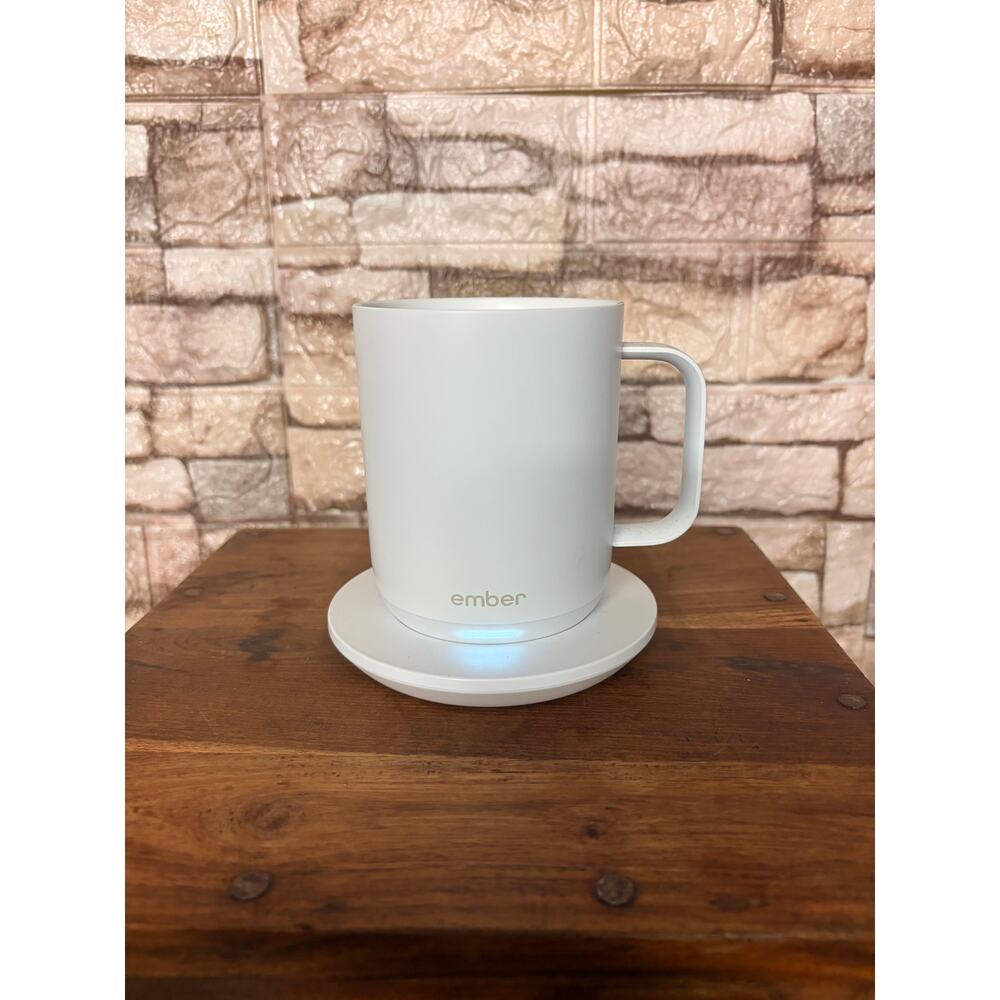 Ember Temperature Control Smart Mug 2 with its charging coaster